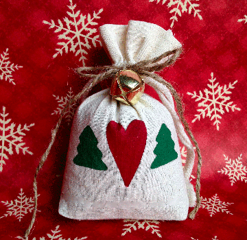 Kelly, our Master Wreath Maker, also crafts keepsake Balsam Sachets… small decorated burlap bags filled with aromatic balsam needles and secured with a ribbon.