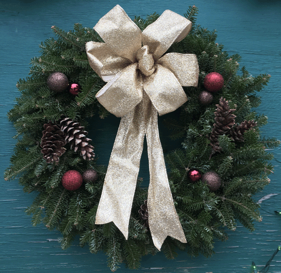 Kelly's beautifully decorated Christmas wreaths can include a hand-tied wire-ribbon bow, berries, real pine cones, and other holiday-themed accessories.